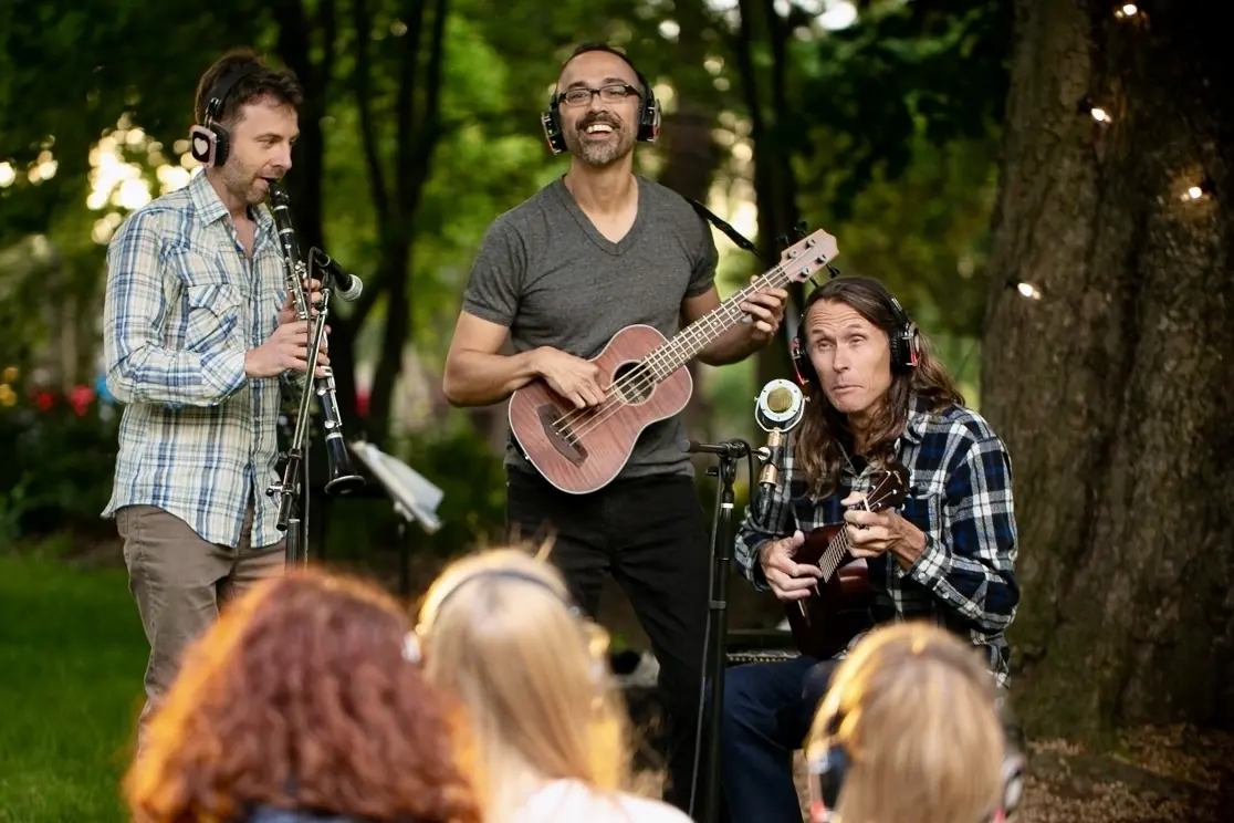 Playing a Kala U-Bass outdoors with a clarinetist and a ukulele player